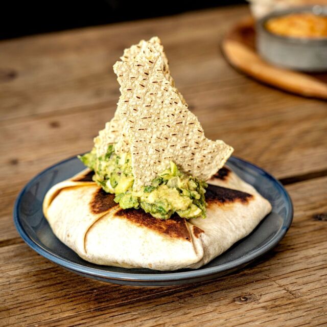 Beef Crunch Wrap: Taco Spiced Beef, Queso Cheese, Sour Cream, Tostada, Topped with Cucumber Guac 

 #summermenu #theploughathanney #crunchwrap